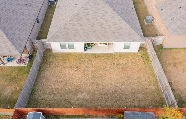 Enjoy open living with a kitchen featuring a breakfast bar sink island, gas range, and walk-in pantry. Relax in a master suite with a 5-foot shower and walk-in closet, plus a private backyard with covered patio and 6-foot fence.