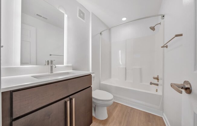 a bathroom with a sink toilet and a shower