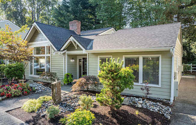 A house with a front yard and a small garden.