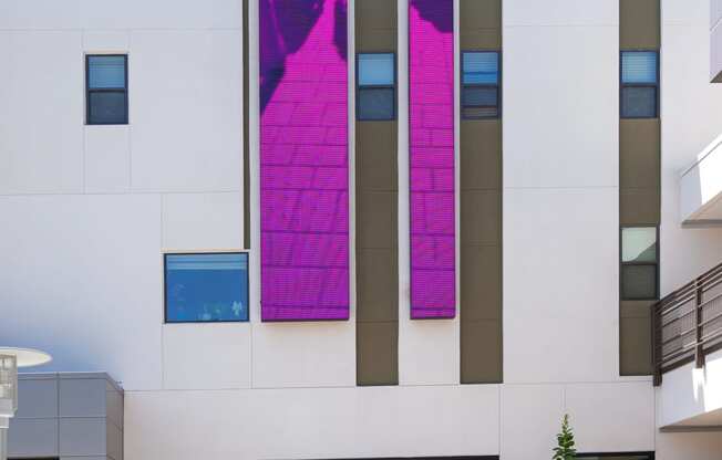 exterior building white and purple with plants