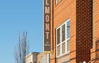 Exterior of four-story building with retail space available on the first floor