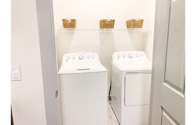 a small laundry room with a washer and dryer