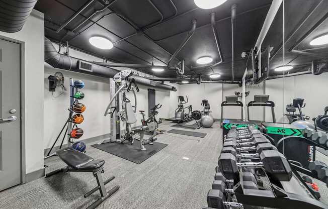 Resident fitness center with cardio equipment at River 595 Apartments