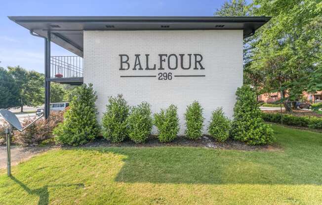 a building with a lawn and trees in front of it  at Balfour 296, Lilburn, Georgia