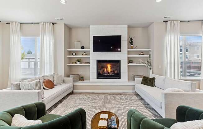 A living room with a fireplace and a television.