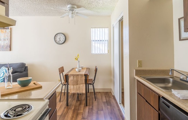 The Springs spacious kitchen with plenty of cabinetry and matching appliances with a dining area near