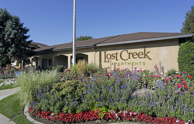 Lost-Creek-Apartments Sign & flowers