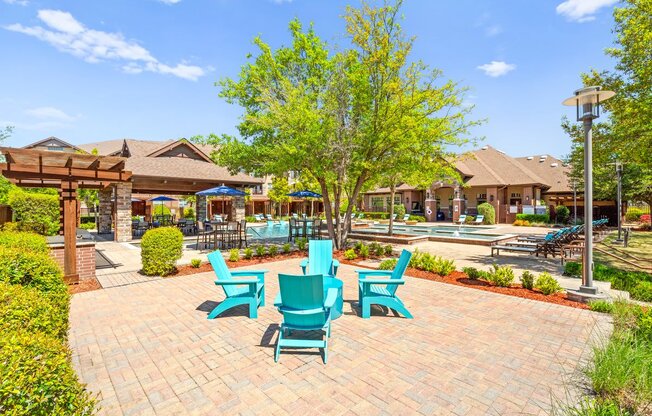 the preserve at ballantyne commons courtyard with blue chairs and trees