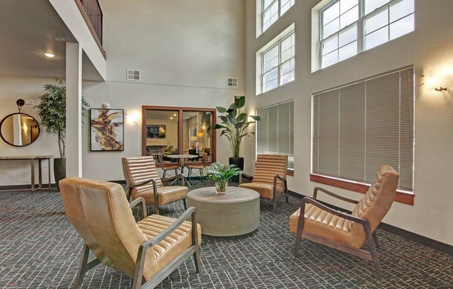 a lobby with chairs and a coffee table
