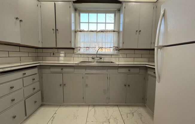 Spacious Multi-Level Living with Vaulted Ceilings and Backyard Access