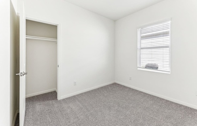 Bedroom with a large closet for ample storage of Dogwood floor plan at Beacon at Presidential Heights in Manor, TX