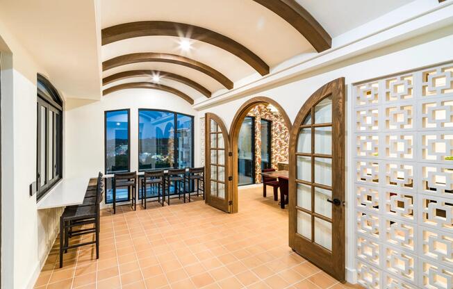 Distinctive archways and warm finishes at Modera Trailhead create inviting spaces for work, play, and gathering with Dallas views.