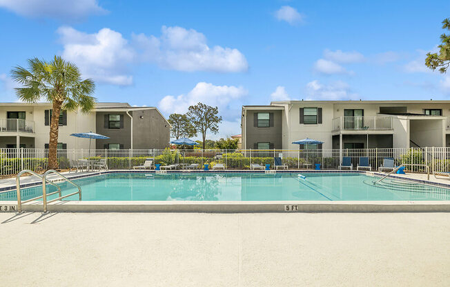 Swimming pool with apartment buildings in the background