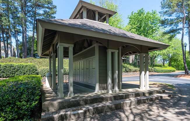 Mail station at Wynnwood Vinings Atlanta with trees and bushes in the background