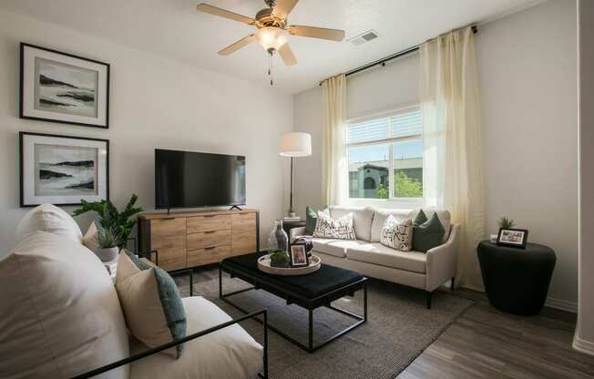 an open living room with a couch and a tv