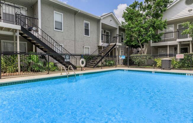 a house with a large pool of water