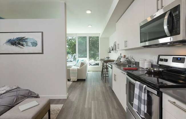 a kitchen with a stove and a microwave