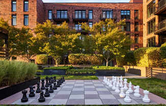 A giant chess board in front of a building.