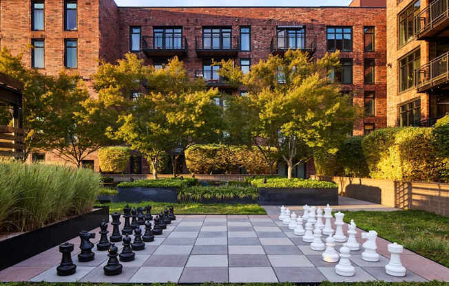 A giant chess board in front of a building.