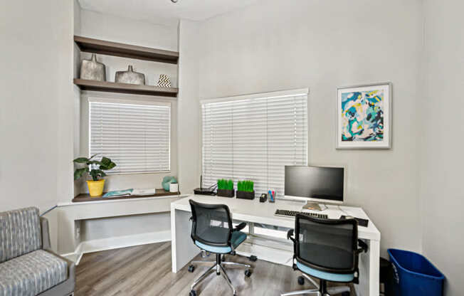 A white desk with a computer and a black chair in front of it at Beacon Ridge Apartments, PRG Real Estate Management, Greenville, 29615