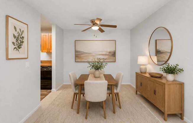 A dining room with a wooden table and chairs.