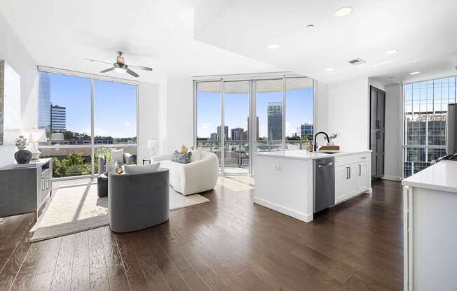 A modern living room with a large window overlooking the city.