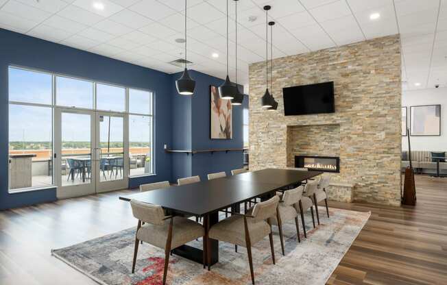 a dining room with a table and chairs and a fireplace