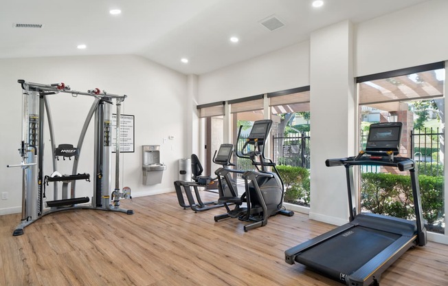 the gym with treadmills and other exercise equipment at the flats at west end