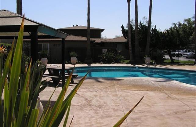 Upstairs 2BD/1BA Condo with 1 reserved covered parking, HOA pool, new paint, new flooring, in Lakeside.