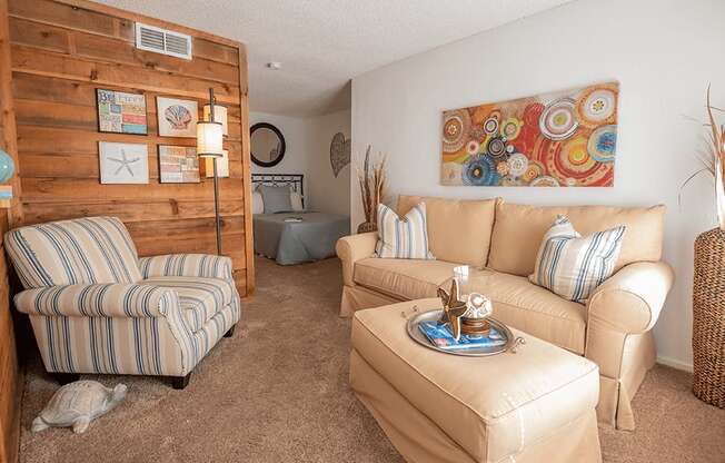 a living room with two couches and a chair