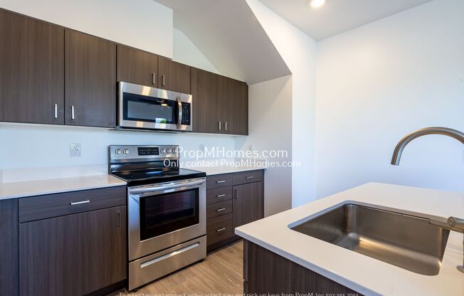 Updated Two Story Unit in SE – Quartz Counters + A/C!