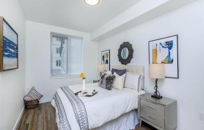 a bedroom with a bed and a dresser next to it at Jefferson Yards, Washington, 98402