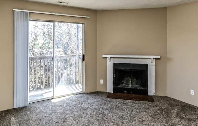 Living room with wood burning fireplace at Fox Valley Apartments in Omaha, NE