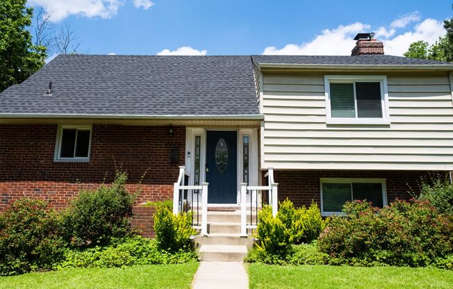 Charming Split-Level Home with Bright Interiors and Spacious Backyard