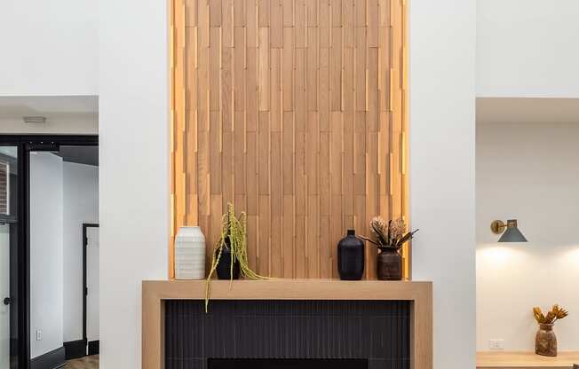 a fireplace with a woodeneworkework above it in a living room