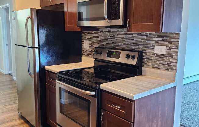 backsplash and stainless steel appliances