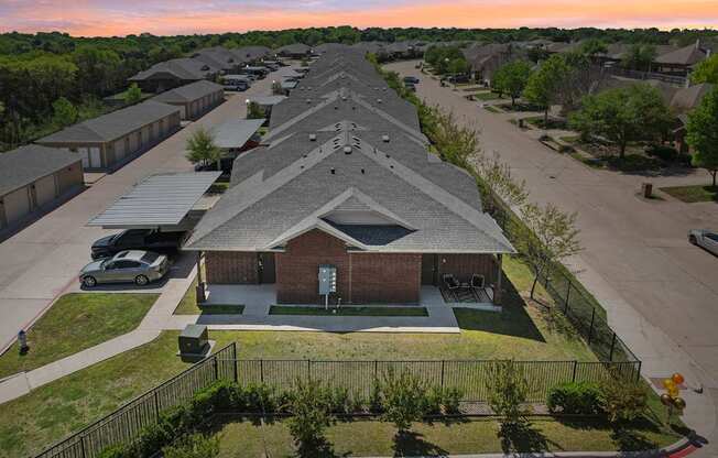 A residential area with houses and a church.
