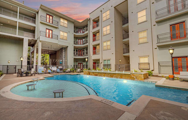 a swimming pool in the middle of an apartment building