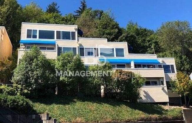 Sweeping Views of City & Mountain! Updated SW PDX Condo. Ton of Light & Upgrades! Parking & Most Utilities Included!
