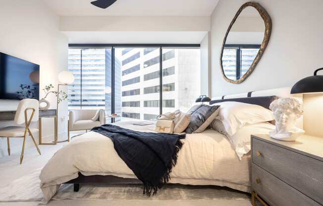 a bedroom with a large bed and a large window at 220 Meridian, Indianapolis, IN 46204