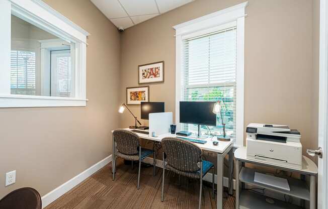 a home office with a desk and a computer
