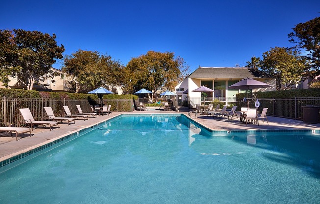 Large pool and lounge area at dusk at Creekwood Villas