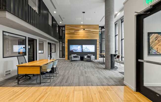 A conference room with a long table and chairs.