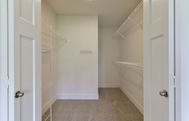 a walk in closet in a home at Chase Creek Apartment Homes, Huntsville