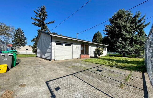 Updated Lents Charmer with Attached Garage~ New Flooring~ Large Fenced Yard & A/C