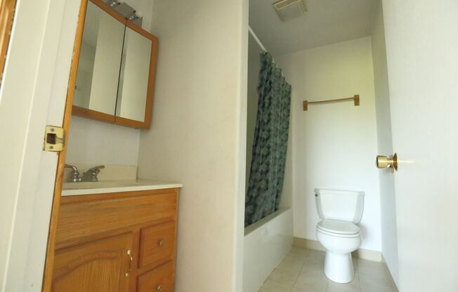 Spacious upper 3-bedroom unit with 2 full bathrooms in an attractive duplex.