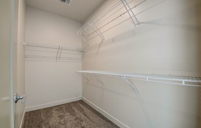 a spacious walk in closet at the historic electric building in fort worth, tx