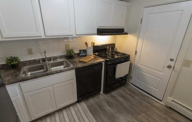 This is a photo of the kitchen in the 740 square foot 1 bedroom model apartment at Compton Lake Apartments in Mt. Healthy, OH.