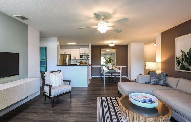 Living Room With TV at Champions Walk Apartment Homes, Florida, 34210