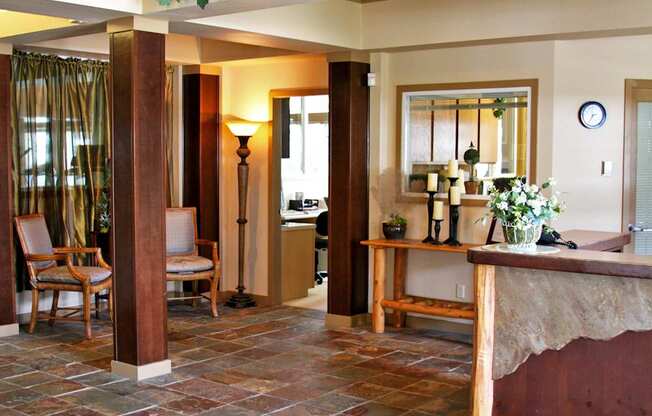 A living room with a chair and a table.